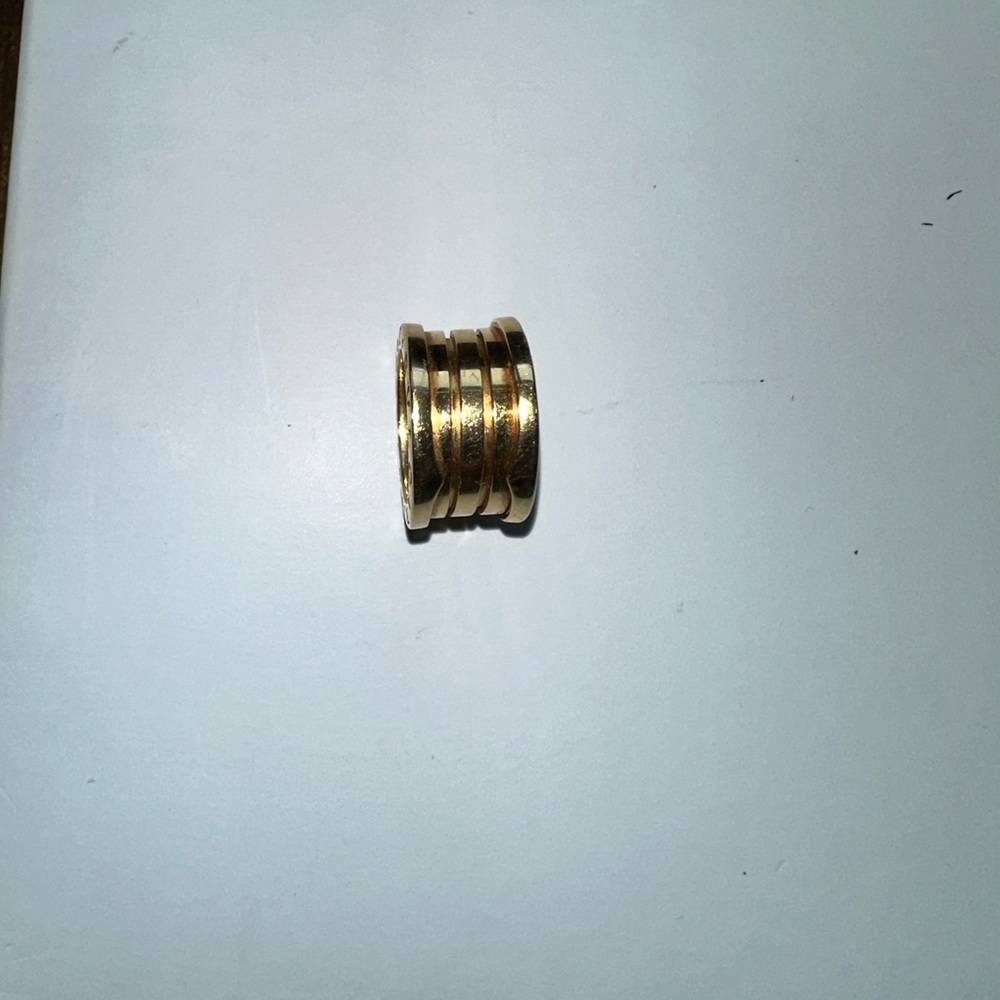 18k Bulgari ring with original box and design. Size 3.5. Poshmark authentic